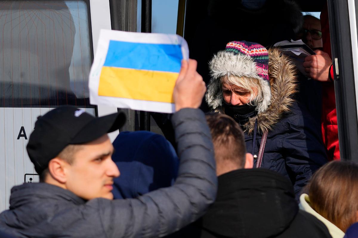 Refugees fleeing the conflict from neighboring Ukraine are transported by bus in the border town of Przemysl, Poland, on Feb. 26, 2022. (Petr David Josek/AP Photo)
