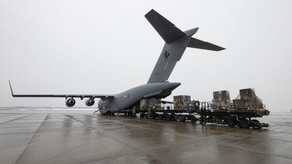 In this image, digitally altered for operational security and obtained by the Royal Australian Air Force, a C-17A Globemaster III, a red defensive military assistance aircraft, was delivered to Europe to support the Ukrainian Government on March 9, 2022. (LSIS Jarrod Mulvihill/ADF)
