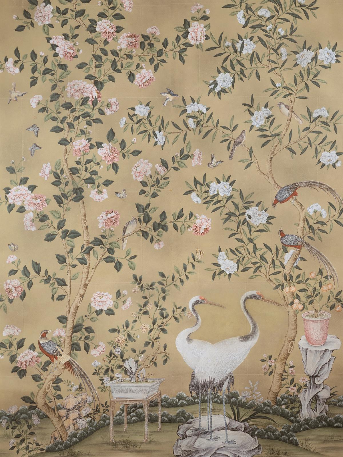A hand-painted Chinoiserie wallpaper by Gracie Studio features birds and flowering trees. (Courtesy of Gracie Studio)