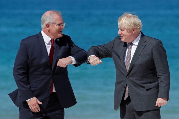 Australia's Prime Minister Scott Morrison (L) meets Britain's Prime Minister Boris Johnson (R) during the G7 summit in Carbis Bay, Cornwall, England on Jun. 12, 2021. (Nicholls/AFP via Getty Images)