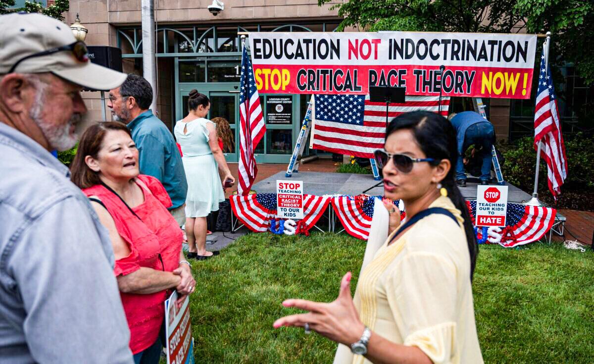 People talk before the start of a rally against "critical race theory" (CRT) being taught in schools, at the Loudoun County Government Center in Leesburg, Va., on June 12, 2021. (Andrew Caballero-Reynolds/AFP via Getty Images)