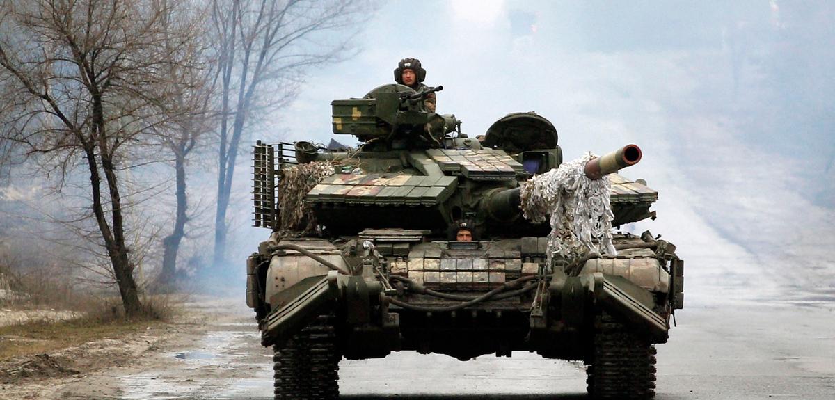Ukrainian servicemen ride on tanks towards the front line with Russian forces in the Lugansk region of Ukraine on Feb. 25, 2022. (Anatolii Stepanov/AFP via Getty Images)