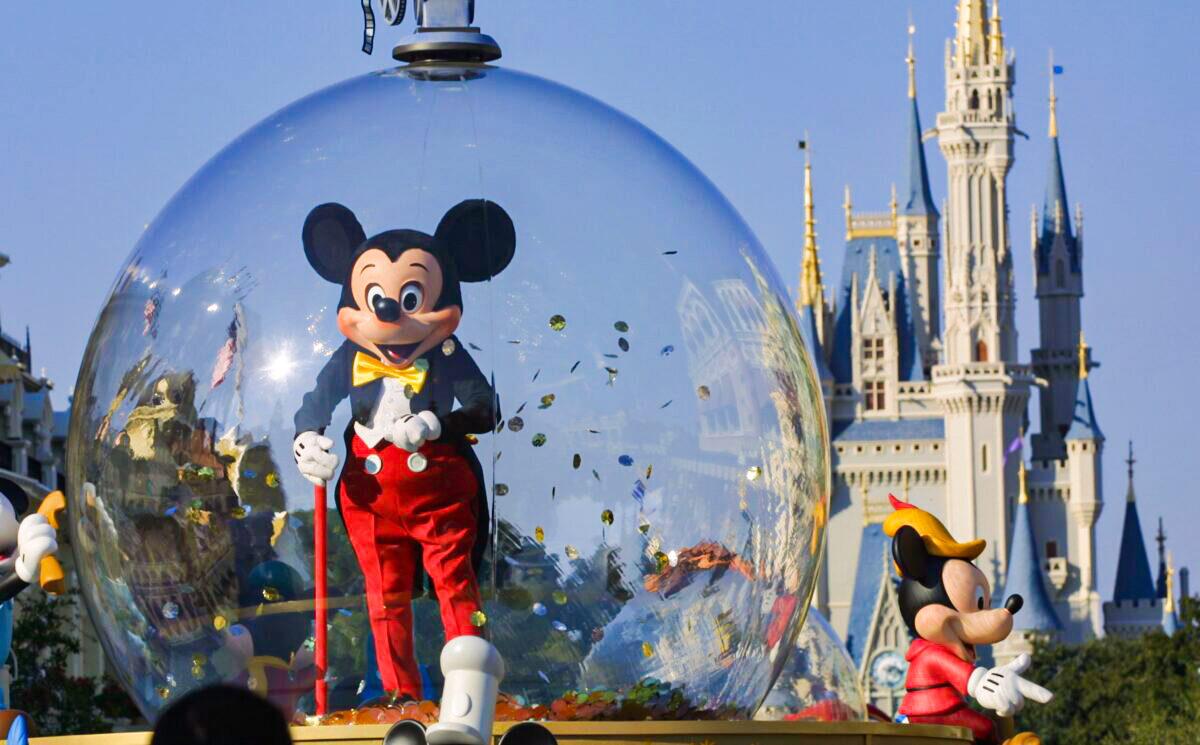 Mickey Mouse rides in a parade at Disney World's Magic Kingdom in Orlando, Fla., on Nov. 11, 2001. (Joe Raedle/Getty Images)