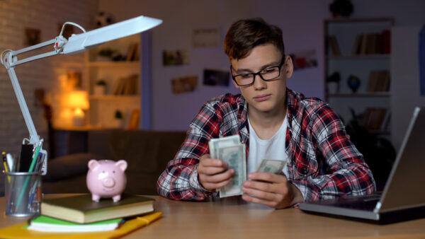 Teaching kids financial responsibility will help prepare them for the real world. (Motortion Films/Shutterstock)