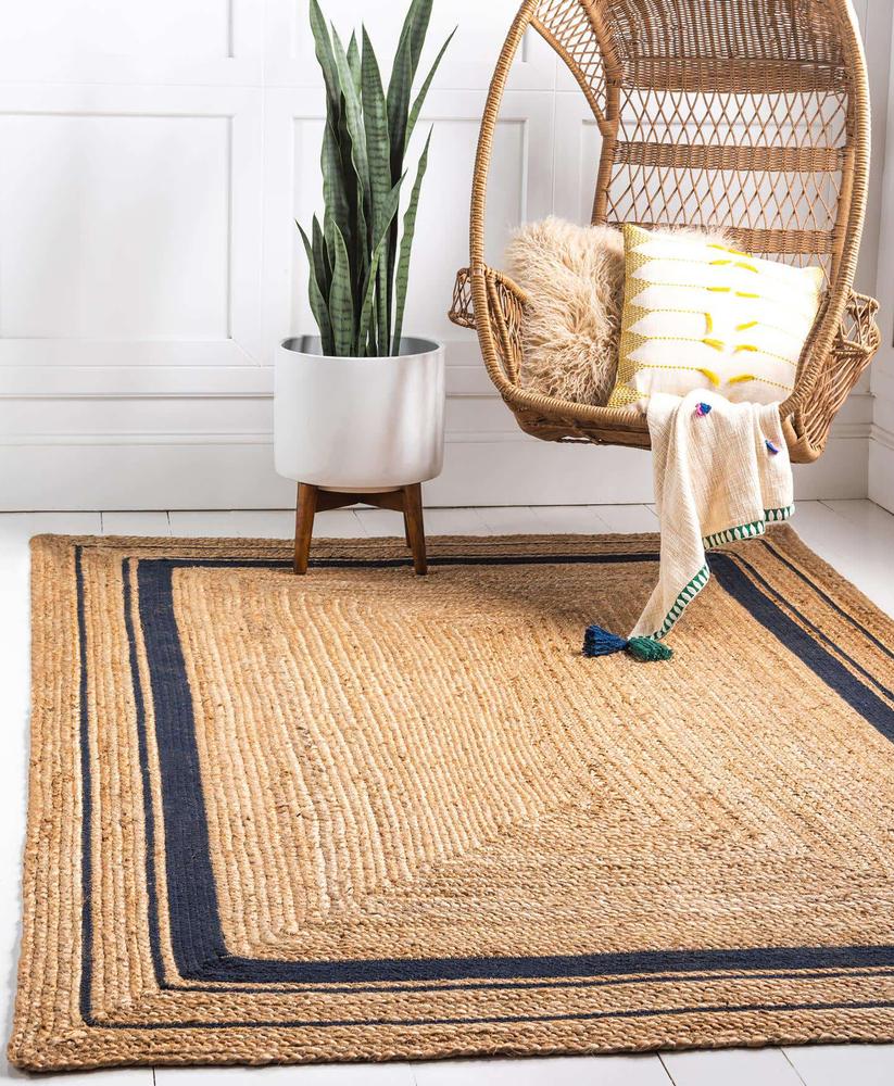 Add an inexpensive sisal or hooked cotton rug to your porch or hallway. (DesignStock09/Shutterstock)
