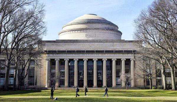 Students walk past the "Great Dome" atop Building 10 on the Massachusetts Institute of Technology campus in Cambridge, Mass., on April 3, 2017. (AP Photo/Charles Krupa, File)