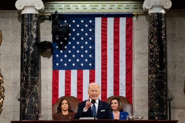 U.S. President Joe Biden delivers the State of the Union address as U.S. Vice President Kamala Harris and House Speaker Nancy Pelosi (D-CA) applaud during a joint session of Congress in the U.S. Capitol House Chamber in Washington, D.C. on March 1, 2022. (Saul Loeb/Pool/Getty Images)