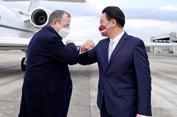 Taiwan's Foreign Minister Joseph Wu (R) greets retired Admiral Mike Mullen, former chair of the Joint Chiefs of Staff, as the latter arrives at Taipei Songshan Airport in Taiwan on March 1, 2022. (Taiwan Ministry of Foreign Affairs via AP)