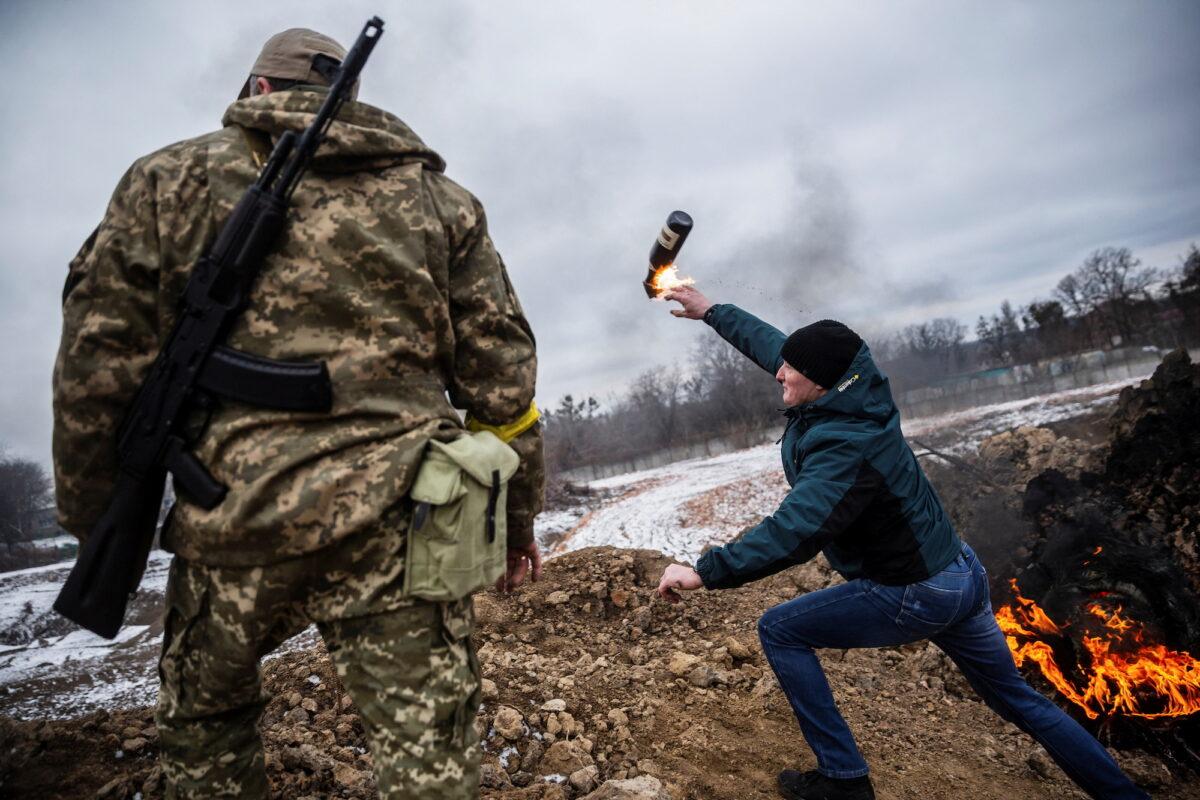 A civilian trains to throw Molotov cocktails to defend the city, as Russia's invasion of Ukraine continues, in Zhytomyr, Ukraine, on March 1, 2022. (Viacheslav Ratynskyi/Reuters)