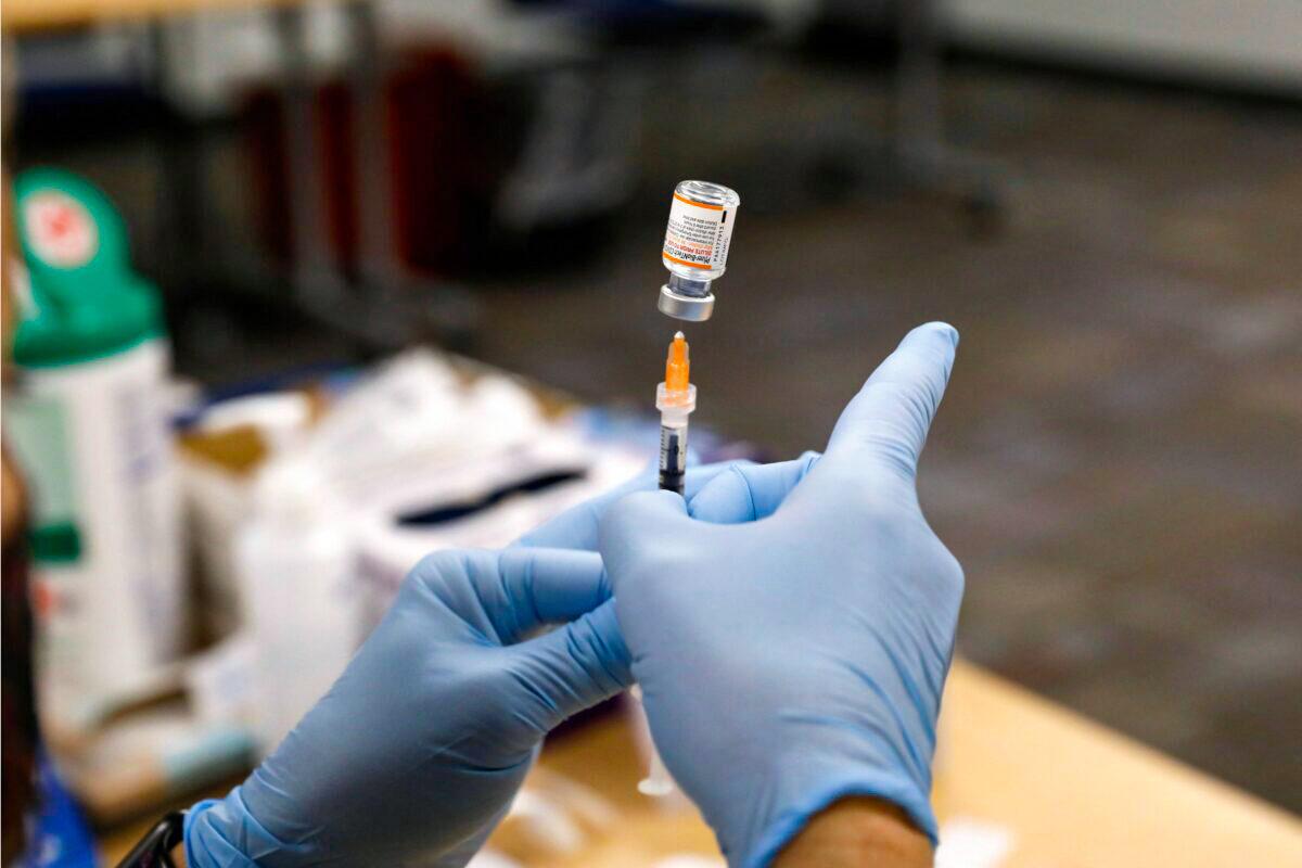A nurse prepares a Pfizer COVID-19 vaccine in Southfield, Mich., on Nov. 5, 2021. (Jeff Kowalsky/AFP via Getty Images)