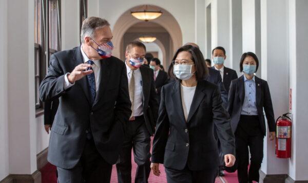 Taiwan's President Tsai Ing-wen and former U.S. Secretary of State Mike Pompeo walk together at the Presidential Building in Taipei on March 3, 2022. (Taiwan Presidential Office/Reuters)