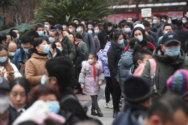 Residents line up to give a sample for nucleic acid testing for COVID-19 in Wuhan, Hubei Province on Feb. 22, 2022. (STR/AFP via Getty Images)