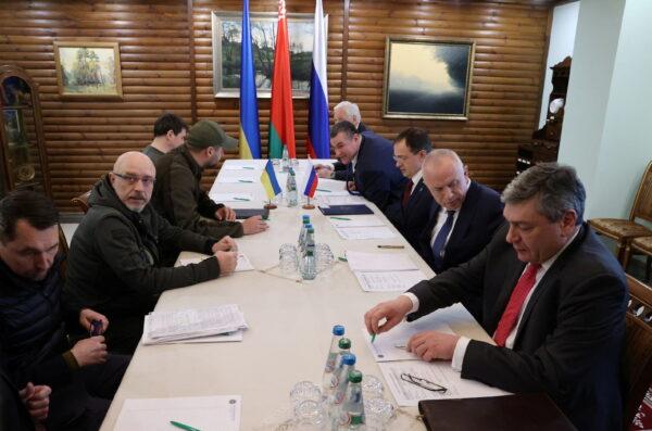 Russian and Ukrainian officials take part in the talks in the Brest region, Belarus, on March 3, 2022. (Maxim Guchek/BelTA via Reuters)