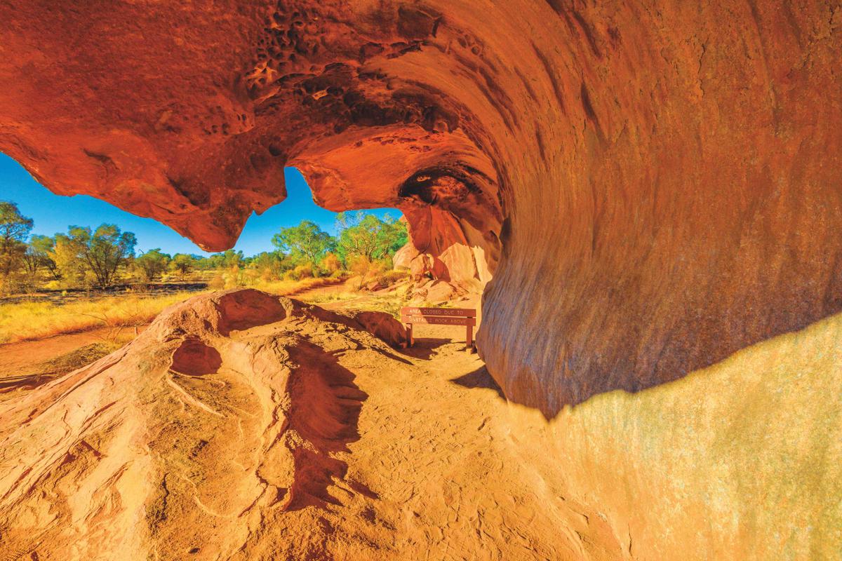 Uluru, Northern Territory, Australia - Aug 23, 2019: Wave shaped rock formation along Mala Walk at base of Ayers Rock in Uluru-Kata Tjuta National Park. This popular walk to Kantju Gorge. (Benny Marty/Shutterstock)
