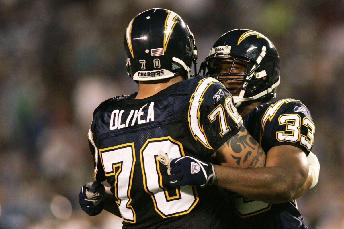 Running back Michael Turner, #33 of the San Diego Chargers, is congratulated after scoring a touchdown against the Seattle Seahawks by teammate Shane Olivea #70 during the first quarter at Qualcomm Stadium in San Diego, Calif., on Aug. 26, 2006. (Todd Warshaw/Getty Images)