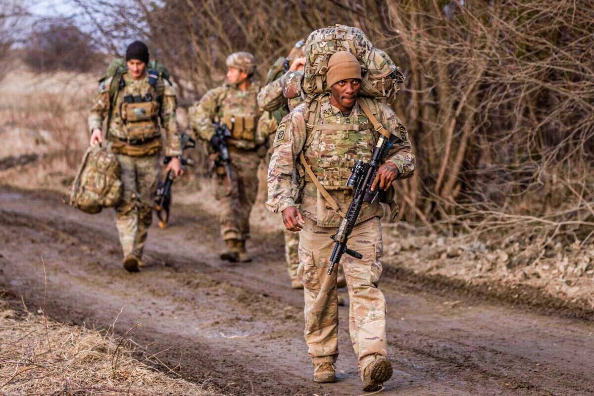 US soldiers walk in Poland near the border with Ukraine, on March 3, 2022. (Wojtek Radwanski/AFP via Getty Images)