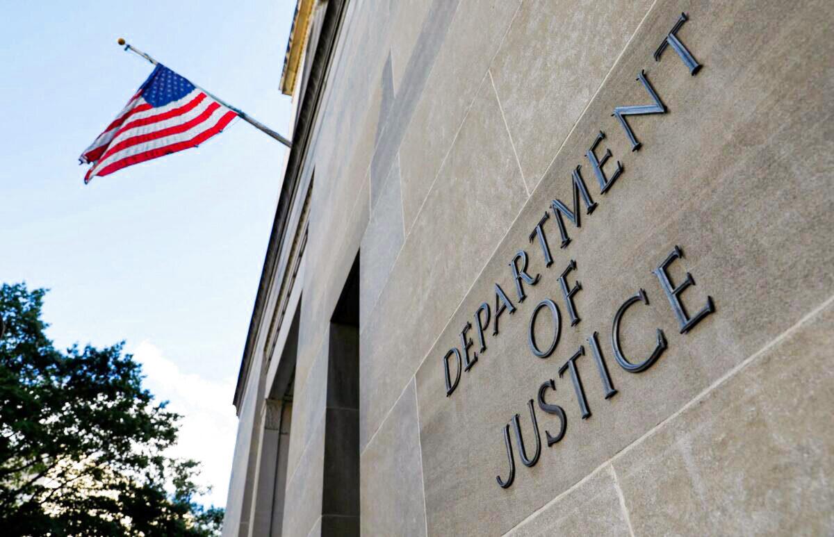 Signage is seen at the United States Department of Justice headquarters in Washington, on Aug. 29, 2020. (Andrew Kelly/Reuters)