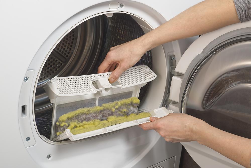 Lint buildup in your dryer vent not only makes your laundry take longer to dry, but it's also a fire hazard. (EngerPhoto/Shutterstock)