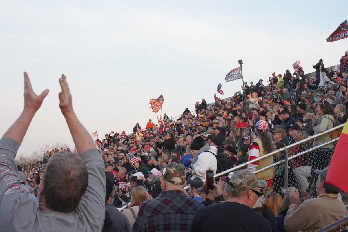 People cheer at a late afternoon rally held by The People's Convoy at Hagerstown Speedway, in Hagerstown, Md., on March 5, 2022. (Enrico Trigoso/The Epoch Times)