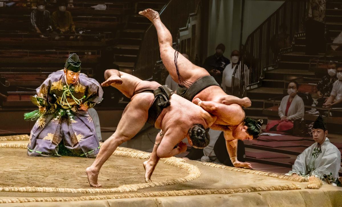 "Sumo Wrestling 10" by Chin Leong Teo, Singapore; "Two sumo wrestlers attempting to trip each other out of the ring in a split-second finish." (© Chin Leong Teo, Singapore, Winner, National Awards, Motion, 2022 Sony World Photography Awards)