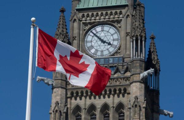 The Canadian flag flies near the Peace Tower on Parliament Hill in Ottawa on June 17, 2020. (The Canadian Press/Adrian Wyld)