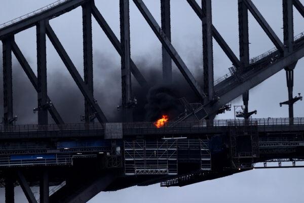 A car burst into flames on Sydney Harbour Bridge in Australia on March 7, 2022. (Brendon Thorne/Getty Images)
