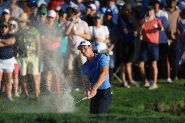 Viktor Hovland of Norway plays a shot from a 17th hole bunker during the final round of the Arnold Palmer Invitational at Arnold Palmer Bay Hill Golf Course in Orlando, Fla., on March 6, 2022. (Sam Greenwood/Getty Images)