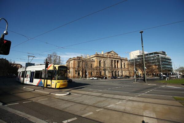 A tram drives past the Supreme Court building in Adelaide's Victoria Square in Adelaide, Australia on August 23, 2015. (Photo by Morne de Klerk/Getty Images)