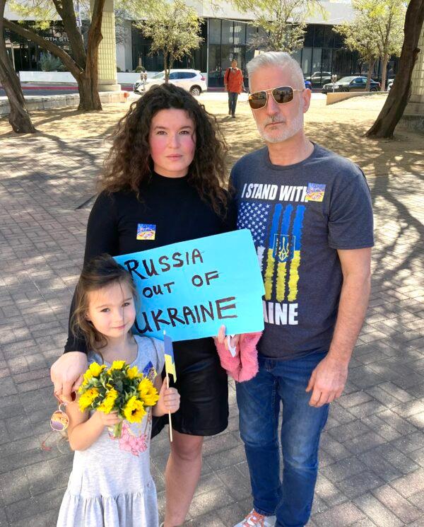 Charlie Masters, his wife Alina, and their daughter Irina, 6, and more than 200 protesters attended a rally in Tucson, Ariz., on March 6 to protest against the Russian invasion of Ukraine. Alina is a native of Kyiv, Ukraine. Masters has a business there. (Allan Stein/The Epoch Times)