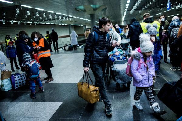 People fleeing war-torn Ukraine arrive on a train from Poland at the Hauptbahnhof main railway station in Berlin on March 6, 2022. (Carsten Koall/Getty Images)