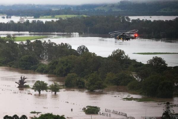 An Australian Army MRH-90 Taipan helicopter from the School of Army Aviation flies over flood-affected properties in Lismore, Australia, on Feb. 28, 2022. (Australian Defence Force)
