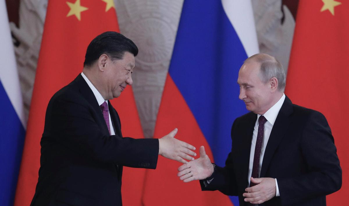  Russian President Vladimir Putin and Chinese leader Xi Jinping shake hands at the end of a joint press conference following their talks at the Kremlin in Moscow on June 5, 2019. (Maxim Shipenkov/AFP via Getty Images)