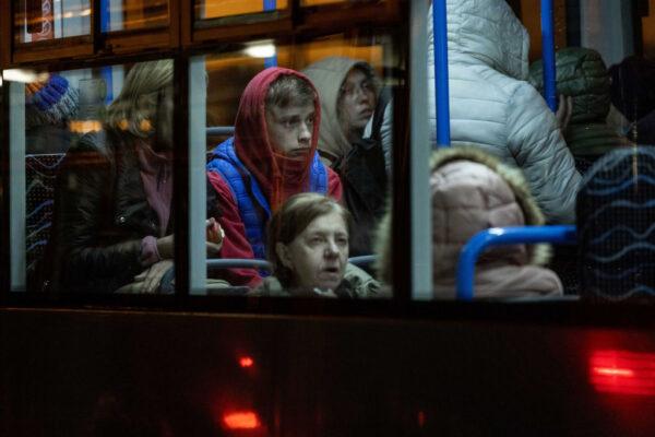 Ukrainian refugees at the Western Railway Station wait in warming buses for the night as they flee Ukraine on March 7, 2022 in Budapest, Hungary. (Photo by Janos Kummer/Getty Images)