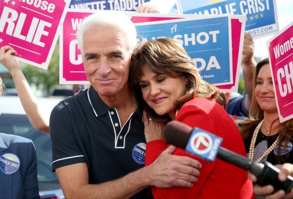 Democratic gubernatorial candidate Charlie Crist hugs Annette Taddeo, his Democratic lieutenant governor candidate as they make a campaign stop at the International brotherhood of Electrical workers Hall Miami, Florida, on Nov. 3, 2014. (Joe Raedle/Getty Images)
