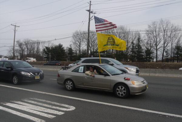 A vehicle participating in the New Jersey convoy on a highway in Edison, New Jersey, on March 5, 2022. (Ella Kietlinska/The Epoch Times)