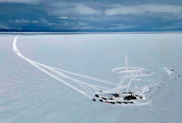 An Alaska Air National Guard helicopter arrives at a frozen lake that was the scene of a small plane crash near Iliamna, Alaska, on March 5, 2022. (Trooper Travis Lons/Alaska State Troopers via AP)
