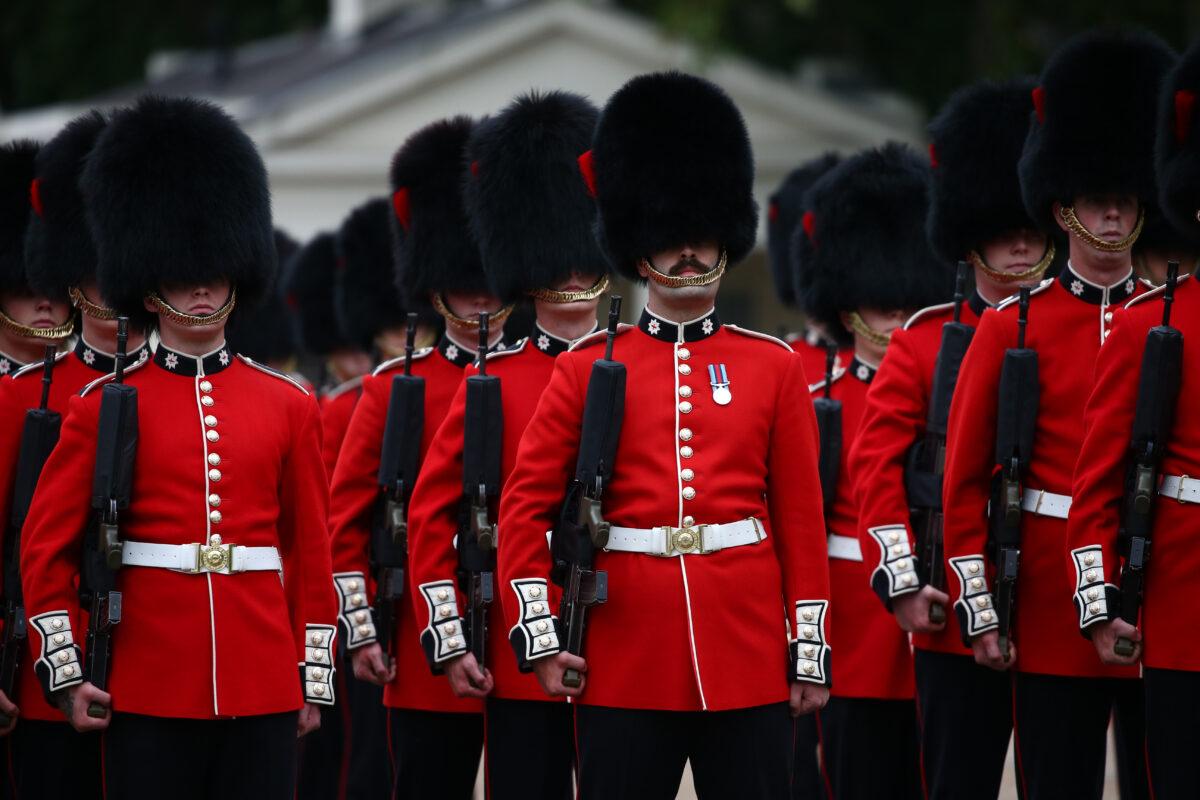 Members of the first battalion of Coldstream Guards participate in the Changing of the Guard ceremony at Wellington Barracks in London, on Aug. 23, 2021. (Hollie Adams/Getty Images)