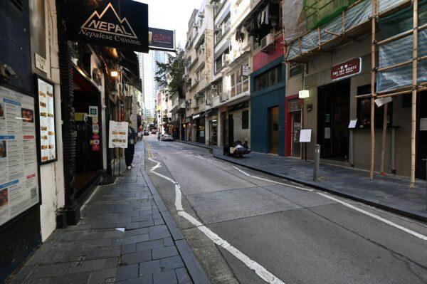 An empty street is seen in the normally bustling bar and restaurant district of SoHo in Hong Kong on March 8, 2022. (Peter Parks/AFP via Getty Images)