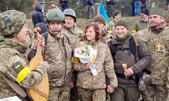 ‘We Must Live in the Moment’: Ukrainian Reservists Marry in Military Fatigues at Kyiv Checkpoint