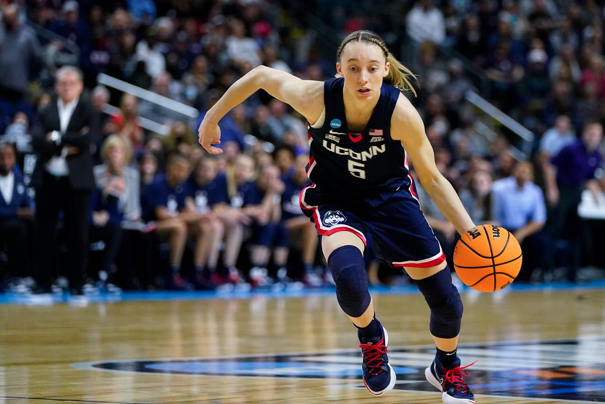 Connecticut guard Paige Bueckers (5) drives to the lane against NC State during the first quarter of the East Regional final college basketball game of the NCAA women's tournament in Bridgeport, Conn., on March 28, 2022. (Frank Franklin II/AP Photo)
