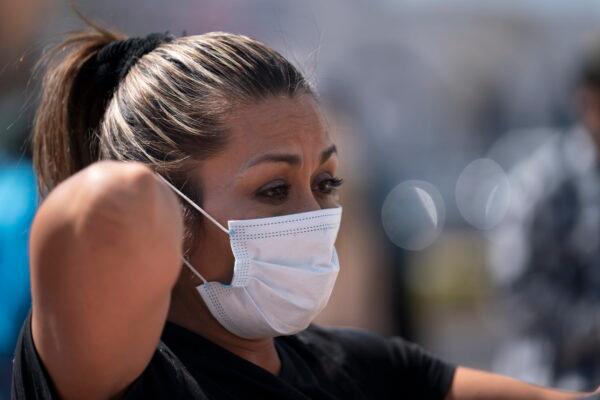 Gabriela Godinez, mother of Gustavo Gomez who was injured at Corregidora stadium, waits for new on her son, outside the General Hospital in Queretaro, Mexico on March 6, 2022. (Marco Ugarte/AP Photo)