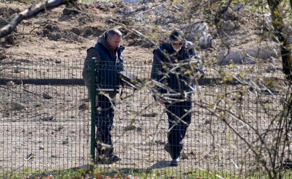 Police inspect the site of a drone crash in Zagreb, Croatia, on March 11, 2022. (Darko Bandic/AP Photo)