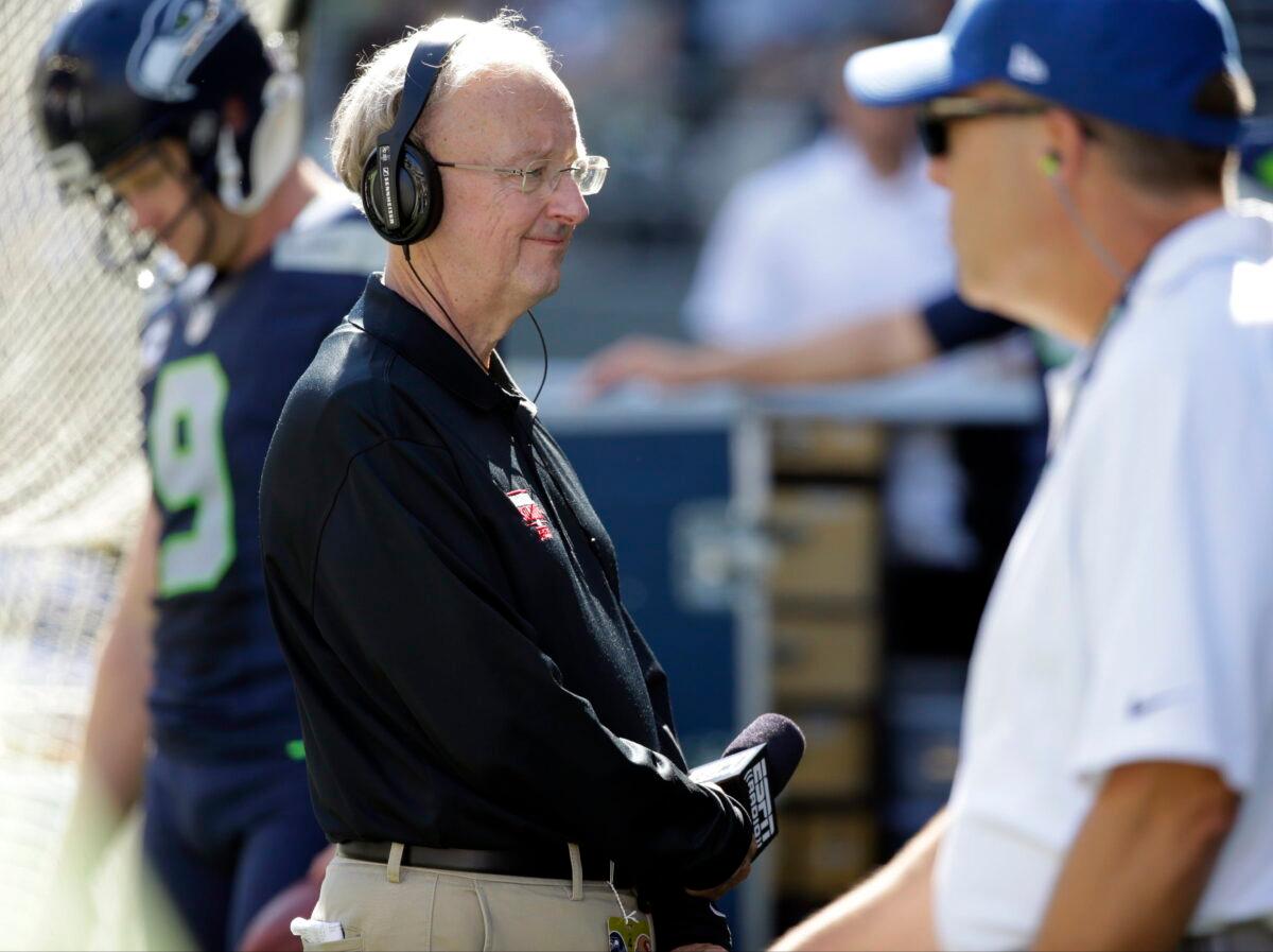 John "The Professor" Clayton, an NFL football writer and reporter for ESPN, stands on the sideline during an NFL football game between the Seattle Seahawks and the San Francisco 49ers in Seattle on Sept. 25, 2016. (Ted S. Warren/AP Photo)