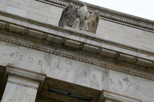 An eagle tops the U.S. Federal Reserve building's facade in Washington, on July 31, 2013. (Jonathan Ernst/Reuters)