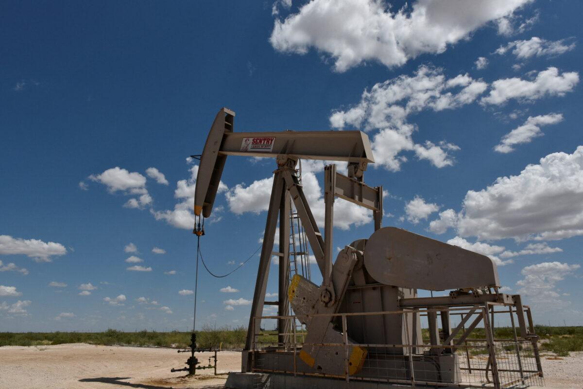 A pump jack operates in the Permian Basin oil production area near Wink, Texas, on Aug. 22, 2018. (Nick Oxford/Reuters)