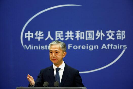 FILE PHOTO: Chinese Foreign Ministry spokesperson Wang Wenbin attends a news conference in Beijing, China March 3, 2022. REUTERS/Carlos Garcia Rawlins/File Photo