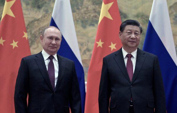 Russian President Vladimir Putin and Chinese leader Xi Jinping pose during their meeting in Beijing, CHina, on Feb. 4, 2022. (Alexei Druzhinin/Sputnik/AFP via Getty Images)