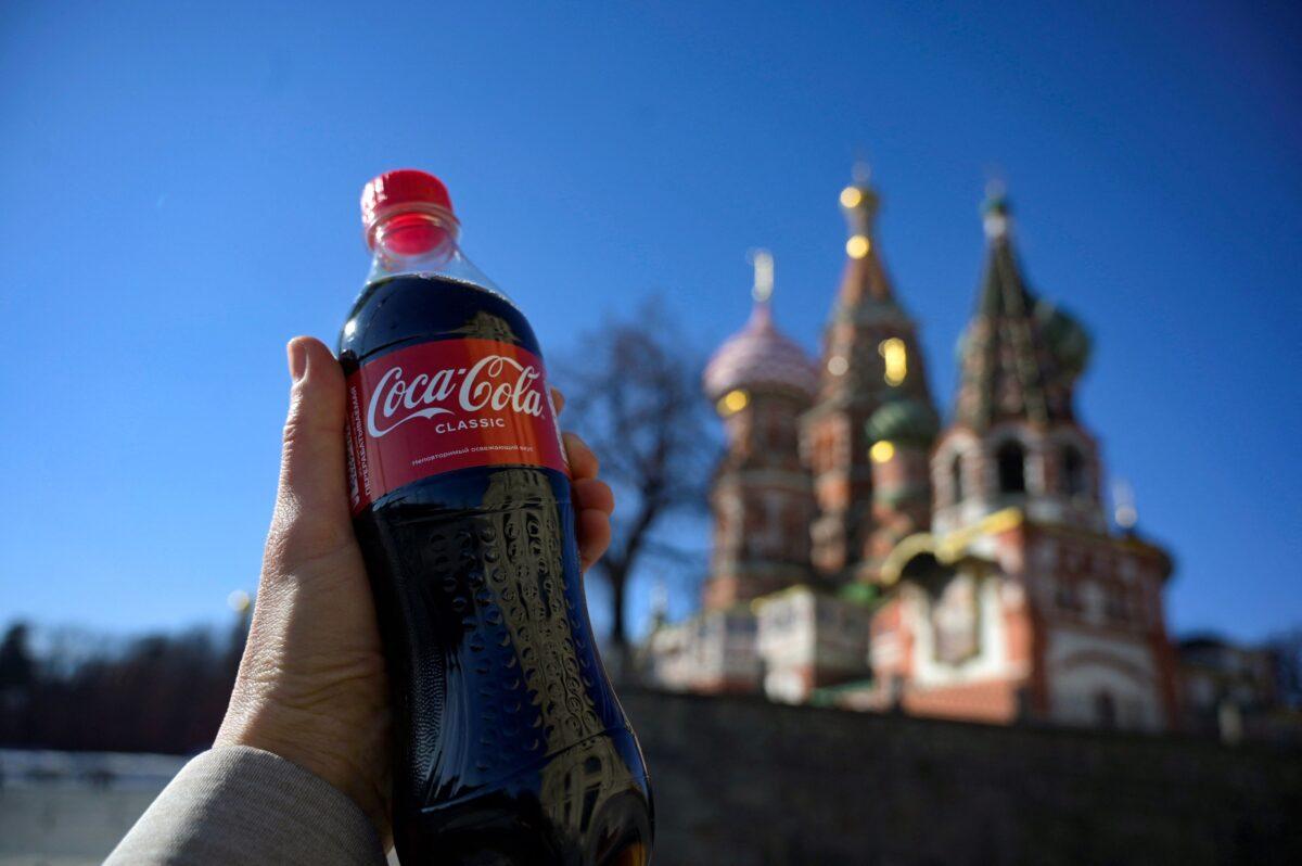 A bottle of Coca-Cola is pictured in front of St. Basil's Cathedral in Moscow on March 9, 2022. (AFP via Getty Images)
