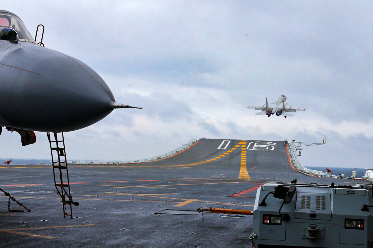 Chinese J-15 fighter jets being launched from the deck of the Liaoning aircraft carrier during military drills in the South China Sea on Jan. 2, 2017.  (STR/AFP via Getty Images)