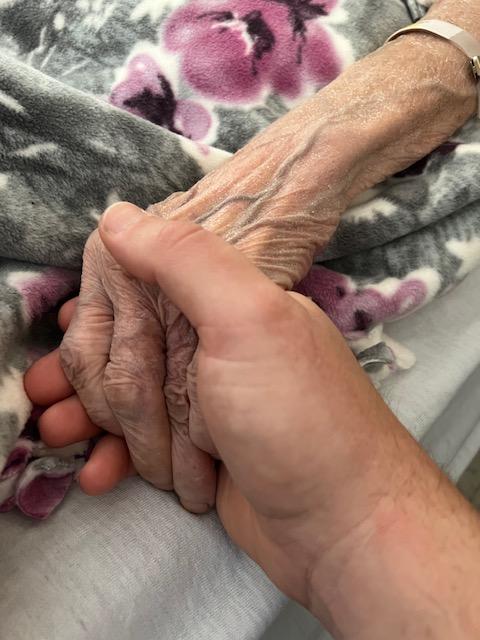 Matthew holding his grandma's hand before she died. (Courtesy of <a href="https://www.instagram.com/stewiez71/">Matthew Stewart</a>)